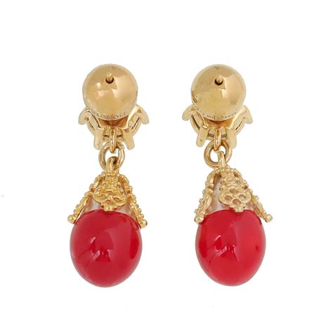 red burberry earrings.